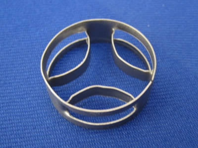 A stainless steel metal super mini ring on the blue background.