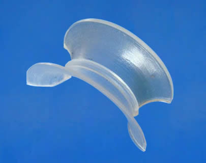 There is a plastic intalox saddle. It has smooth and arc surface.