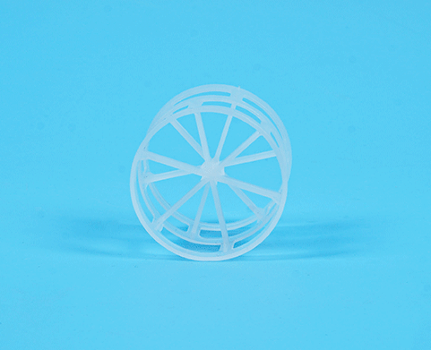 A 360-degree view of a plastic Pall ring against a blue background