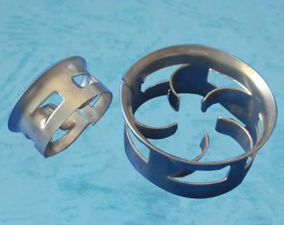 Two metal cascade mini rings on a blue background. The big one shows its five curved blades.